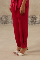 Close-up of ankle seam detail on rani pink satin trousers