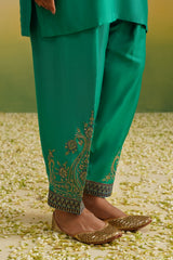 Detail of embroidered ankle border on emerald green salwar