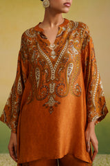 Detail of rust cream paisley printed coord top