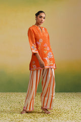 Woman wearing orange floral printed tissue kurta with striped farshi salwar