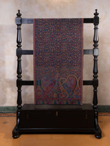 Jewel-tone paisley stoles laid out for anniversary gifting