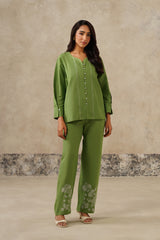 Front view of green linen shirt coord set with sweetheart neckline