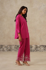 Side view of fuchsia collared shirt coord with V-neckline