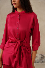 Detail of wrap tie waist on rani pink satin shirt
