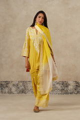 Woman wearing yellow Aari embroidered farshi salwar set for haldi with ombre dupatta