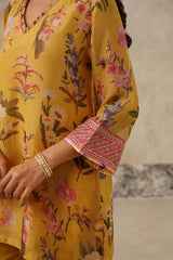 embroidered cuff of yellow printed tissue suit