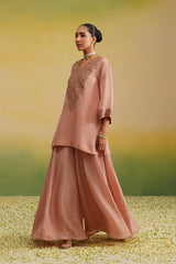 side view of pink tissue sharara set
