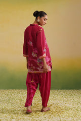 back view of Woman wearing pink floral printed tissue co-ord set with striped salwar